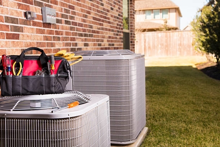 HVAC unit with tools on top